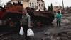 'I won't leave him': Ukrainian mother weeps after finding corpse of her young son at roadside grave in Bucha
