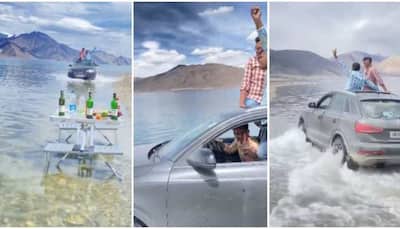 SHAME! Tourists drive Audi Q3 through Ladakh's Pangong Lake, netizens furious - WATCH