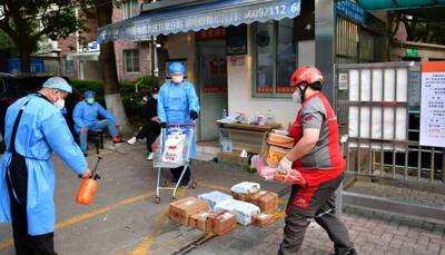 Shanghai steps up quarantine transfers as new Covid-19 cases decline