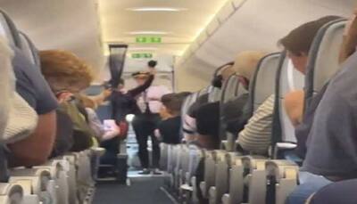 Watch: Passengers celebrate as pilot announces removal of mask on flight, netizens react