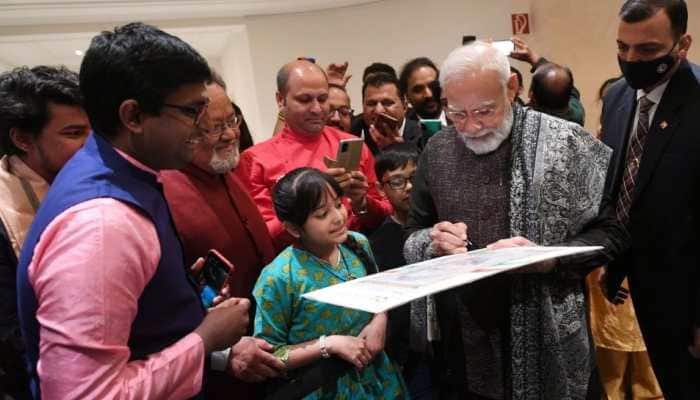 Narendra Modi&#039;s 3-day, 3-nation Europe visit: PM signs portrait made by a little girl, gets rousing welcome from Indian diaspora - Watch 