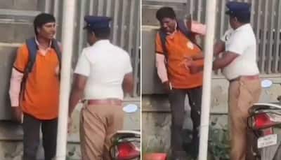 Traffic cop brutally slaps Swiggy delivery agent, snatches his phone; gets transferred - Watch