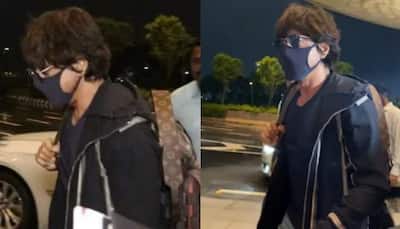 Shah Rukh Khan snapped at Mumbai airport in style, shakes hand with CISF officer on duty!