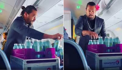 Hollywood Actor Jason Momoa poses as flight attendant, serve drinks to passengers on Hawaii flight - Watch Video