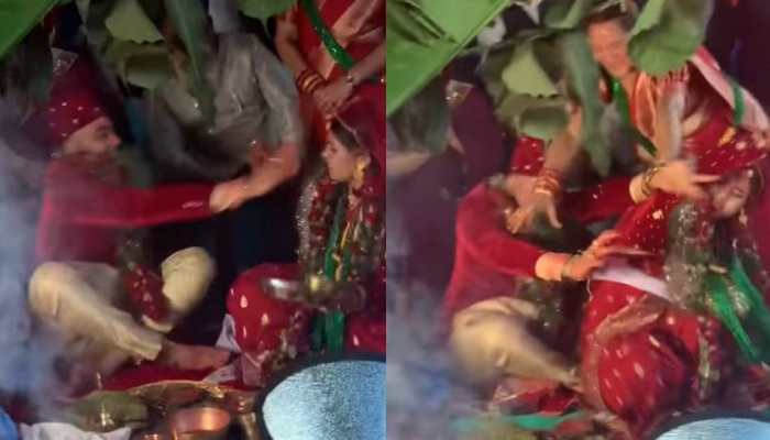 Viral Video: Bride and Groom fight like cats and dogs in mandap, leave guests stunned by doing THIS - Watch Viral Video: Bride and Groom fight like cats and dogs in mandap, leave guests stunned by doing THIS - Watch