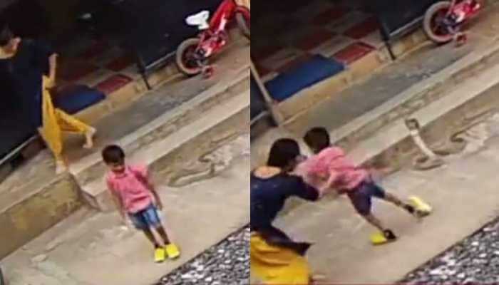 Woman&#039;s BRAVERY saves her son from huge snake outside their home - Watch viral video