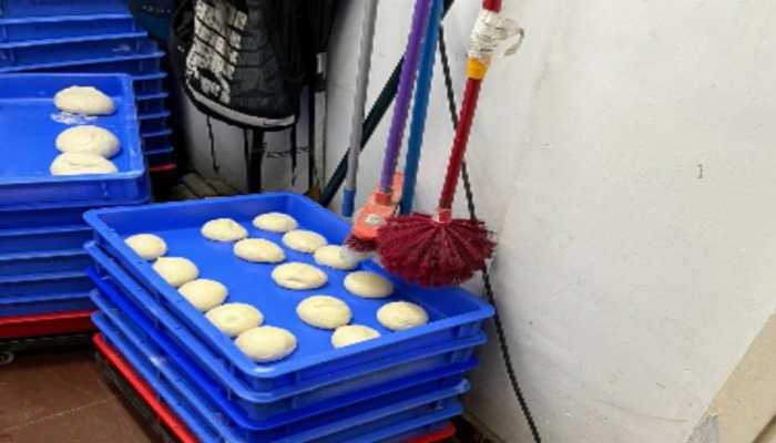 Domino’s India clarifies after photos of mops hanging above trays of pizza dough goes viral