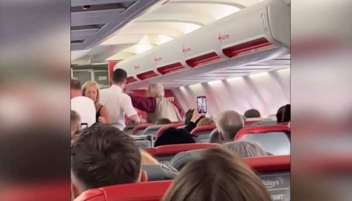 Elderly woman slaps flight attendant for refusing to give alcohol forcing pilot to divert plane, video goes VIRAL