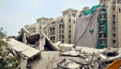 Noida Twin Towers demolition: Nearby residents return; huge debris chunk damages ATS village wall