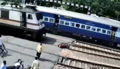 Bike blown into pieces at railway track, commuter suffers narrow escape - Watch