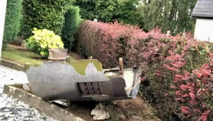 Engine part of a Boeing 747 plane falls at garage roof, residents in SHOCK