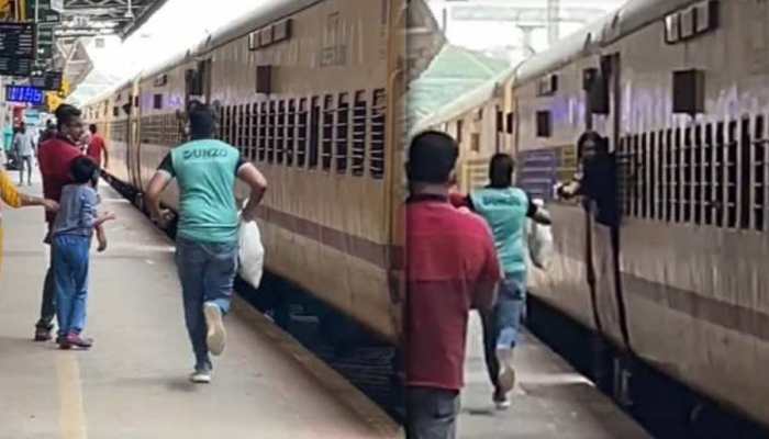 Dunzo delivery guy RAN along the moving train on the platform to DELIVER a parcel to passenger | Viral video