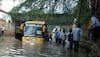 bus gets stuck in water-logged underpass