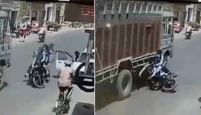 HORRIFIC Video! Bikers crashing into a moving truck shows why you should open car's door carefully?