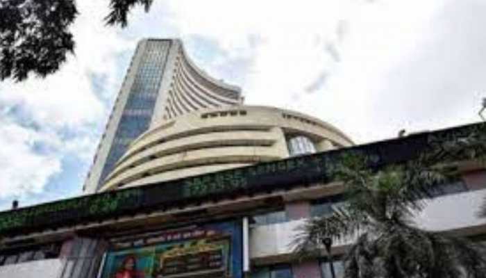 Benchmark Indexes Nifty and Sensex close in red amid choppy market; Titan share up by 5.27%