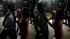 Noida: Drunk woman grabs society guard by collar, flings his cap in the air - WATCH