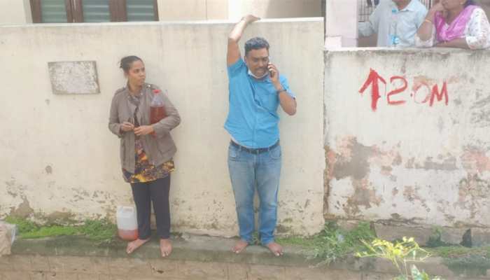Faced with house demolition, Bengaluru couple threatens self-immolation; police foil bid - WATCH