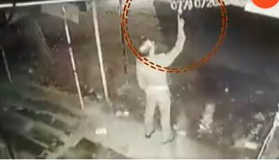 Viral Video: UP inspector caught stealing light bulb outside paan shop in Prayagraj - WATCH