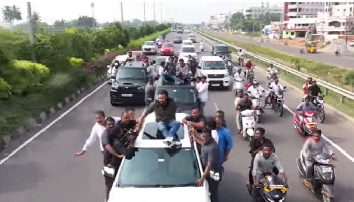 Actor turned Politician Pawan Kalyan arrives in village sitting on car roof, ignores all road SAFETY rules