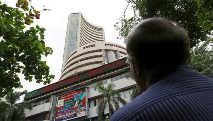 Sensex, Nifty open flat; rupee gains 25 paise against US dollar
