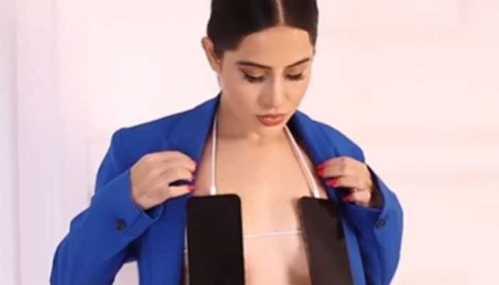 Urfi Javed is all CHARGED UP, wears mobile phones as bralette in new bizarre video - Watch