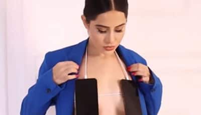 Urfi Javed is all CHARGED UP, wears mobile phones as bralette in new bizarre video - Watch