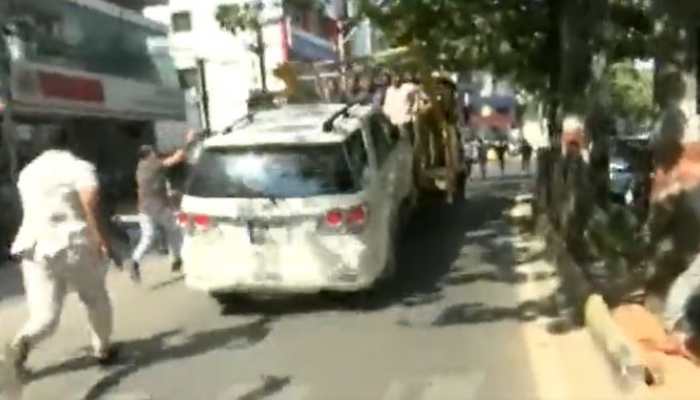 Andhra CM's sister, protesting against him, dragged away along with her car in