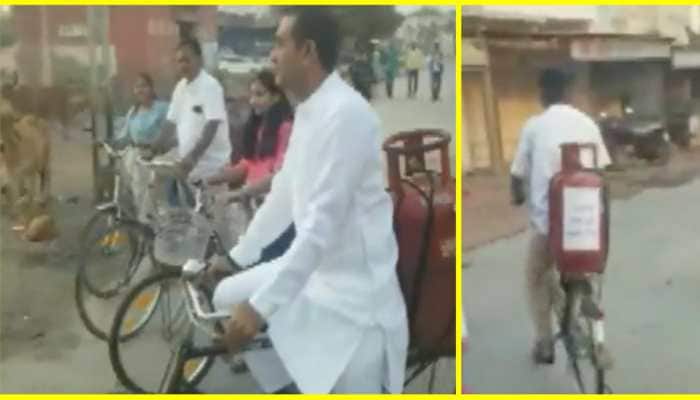 Gujarat Assembly Elections 2022: Congress MLA Paresh Dhanani rides bicycle with gas cylinder to polling booth - WATCH