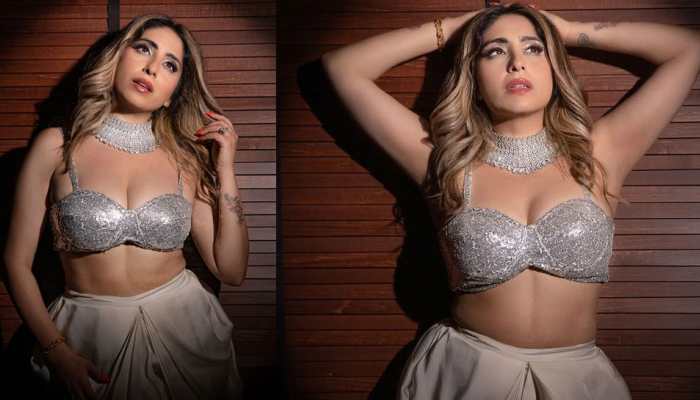 Neha Bhasin's enchanting video in a shimmering silver bralette and dhoti pants