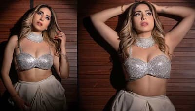 Neha Bhasin's enchanting video in a shimmering silver bralette and white dhoti pants is too HOT to handle - Watch