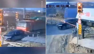 Scary moment for driver as truck pushes car towards fast-moving train, here’s what happened next: WATCH
