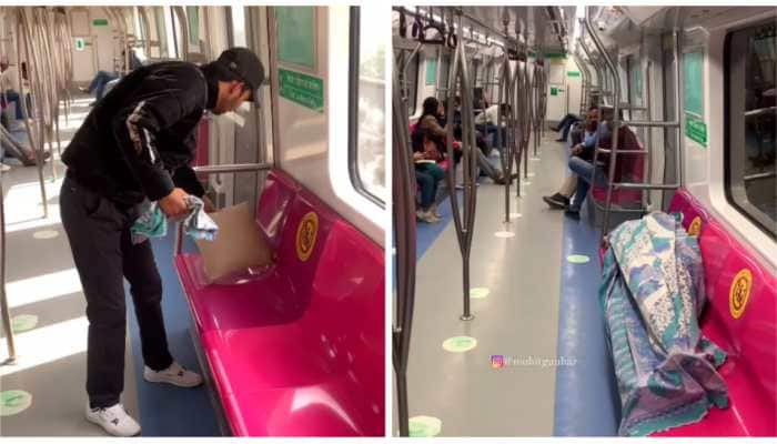 Viral Video: Man sets up bed on empty seat, sleeps inside Delhi Metro