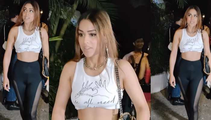 Nia Sharma heads out in a high-waist black sheer mesh leggings and white crop top paired with high heels - Watch