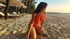 Amid Besharam Rang controversy, Neha Sharma sizzles in a saffron colour monokini on a beach - SEE PICS