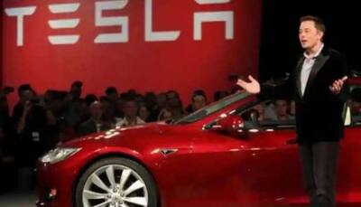 Tesla shares snap losing rally; sees record rare jump