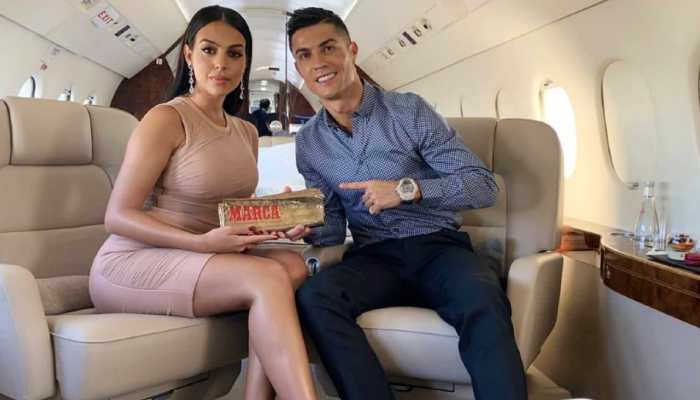 Portugal footballer Cristiano Ronaldo with partner Georgina Rodriguez on his private jet en route to Riyadh in Saudi Arabia. Ronaldo was unveiled as Al Nassr football club's latest signing.