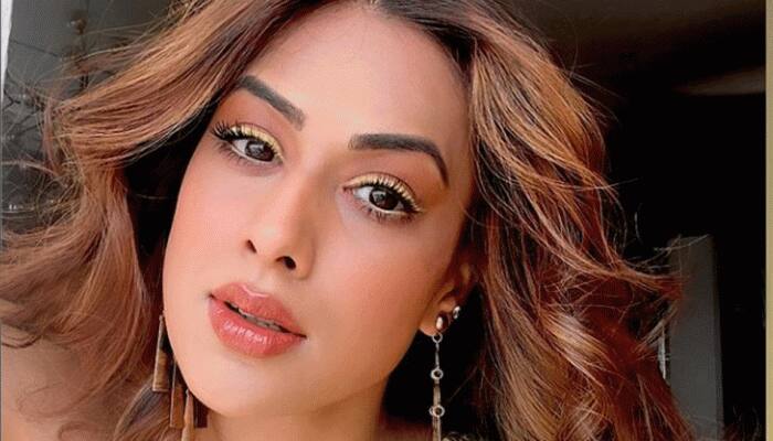 Nia Sharma shows off her flexibility on trampoline, flaunts toned body in black monokini: Video