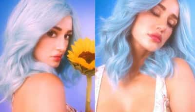 Disha Patani oozes oomph in plunging neckline top, poses in blue hair with a sunflower! SEE PICS 