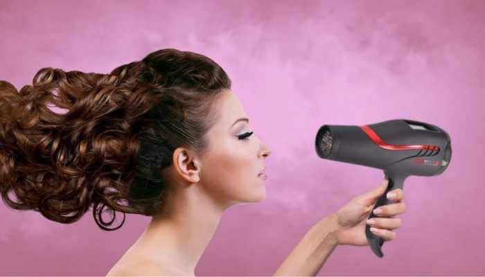 Hair care in winter: Blow-drying your tresses? Dermatologist says it can  cause SEVERE damage | Health News | Zee News