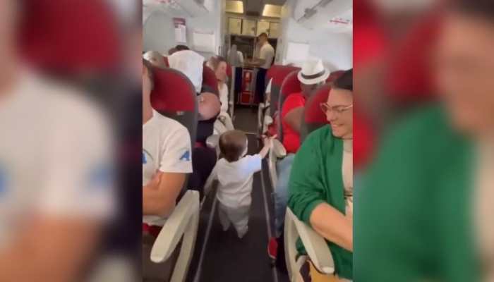 Toddler greeting passengers on flight makes Netizens go ‘Aww’: Watch viral video