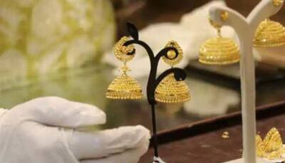 Gold declines Rs 105; silver rises Rs 52