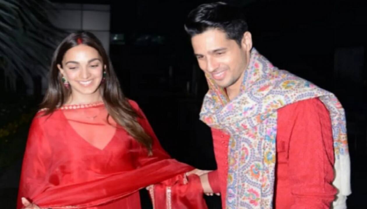 Newly-married couple Sidharth Malhotra and Kiara Advani are a royal display  of ethnic style in red Manish Malhotra ensembles as they arrive in Delhi :  Bollywood News - Bollywood Hungama