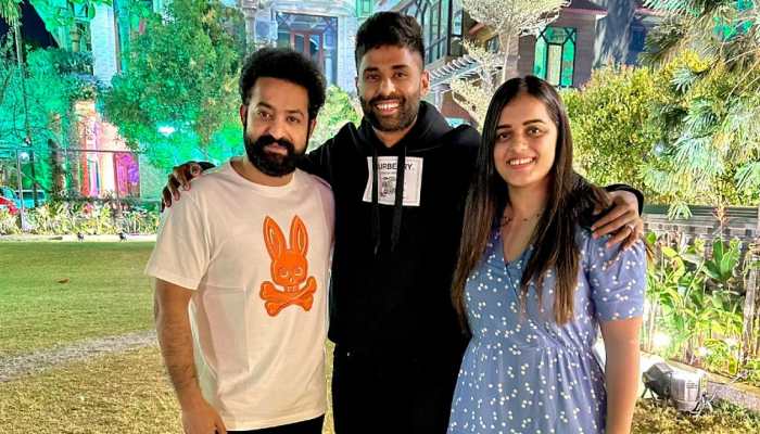 Team India batter Suryakumar Yadav with wife Devisha Shetty and 'RRR' star Jr NTR. (Source: Twitter)