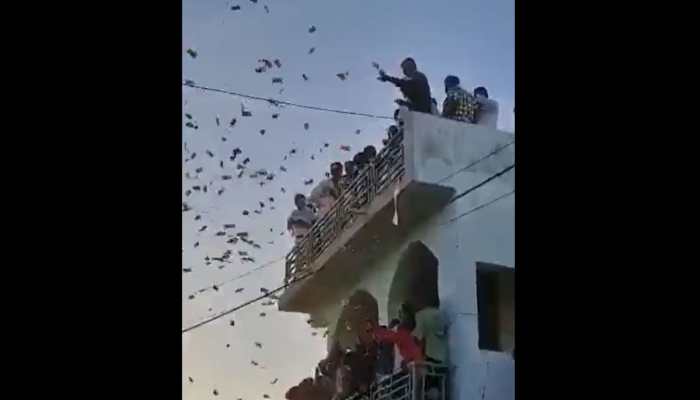 'Noton Ki Barish': Ex-Sarpanch Showers Bundles of Notes at Nephew’s Wedding In Mehsana - WatchViral Video