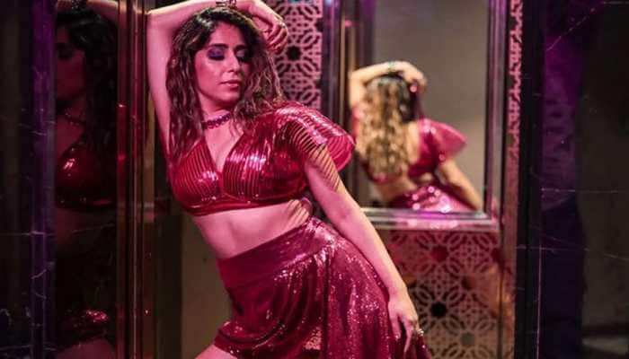 Neha Bhasin Raises Hotness Bar In a Bold Pink Metallic Bralette And Short Skirt With a Trail - Pics