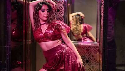 Neha Bhasin Raises Hotness Bar In a Bold Pink Metallic Bralette And Short Skirt With a Trail - Pics
