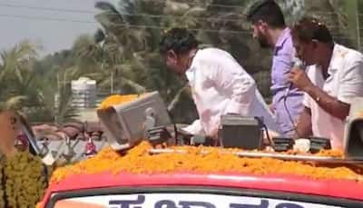 WATCH: Karnataka Congress Chief D K Shivakumar Throws Currency Notes During Poll Campaign, Booked