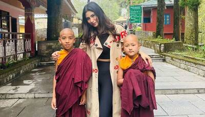 Mouni Roy Grabs Attention In Backless White Dress, Visits Buddhist Monastery, Enjoys Momos