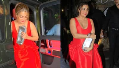 Malaika's Sister Amrita Arora Averts Oops Moment In Red Hot Deep Neckline Dress - Watch 