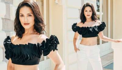 Cannes Film Festival Day 6: Sunny Leone Stuns In Black Off-Shoulder Top With White Pants- Pics 
